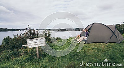 Couple camping with a tent at the seaside in Bergen, Norway Stock Photo