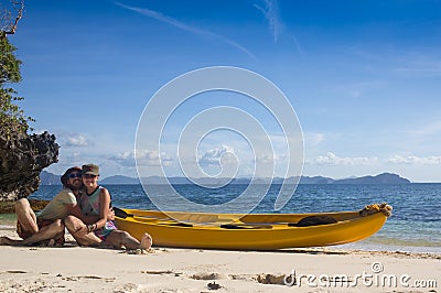 Couple canoeing in lagoon of West French indies Stock Photo