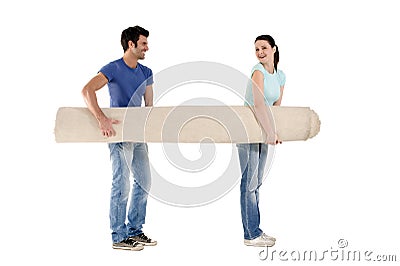 Couple carrying a carpet Stock Photo