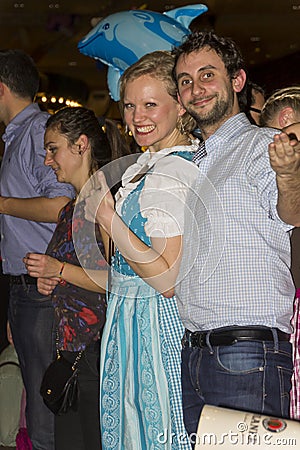 A couple celebrating on the famous Munich Strong Beer Festival. Editorial Stock Photo