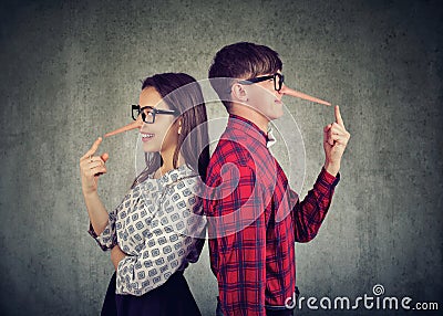 Couple of cheaters, satnding back to back two liars Stock Photo