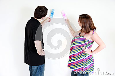 Couple choosing paint color Stock Photo