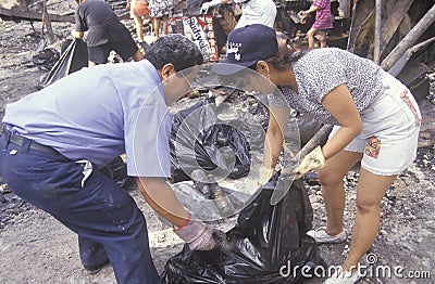 Couple cleaning up after 1992 riots Editorial Stock Photo