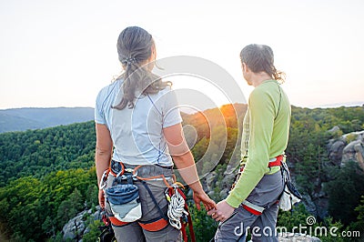 Couple of climbers resting and enjoying beautiful nature view Stock Photo