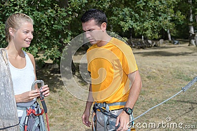 Couple climbers with ropes getiting ready to hike Stock Photo