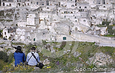 Couple in contemplation of the city of matera from the heights placed in front Editorial Stock Photo