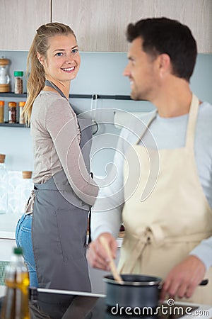 couple cooking at home in scene domestic bliss Stock Photo