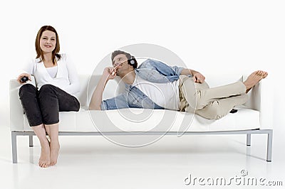 Couple on the couch watching TV Stock Photo