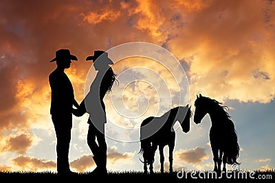 Couple of cowboys with horse at sunset Stock Photo