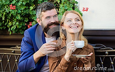 Couple cuddling cafe terrace. Couple in love sit hug cafe terrace enjoy coffee. Pleasant family weekend. Explore cafe Stock Photo