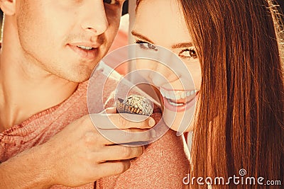 Couple on date with cupcake. Stock Photo