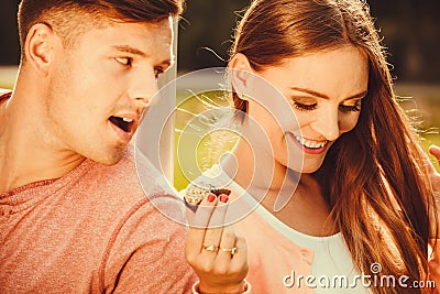 Couple on date with cupcake. Stock Photo