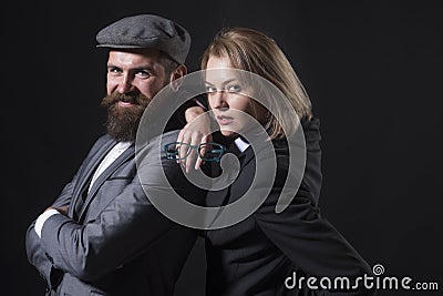 Couple detectives investigators partners. Partnership clever intelligent reporter investigator. Man and blonde woman Stock Photo