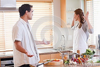 Couple disputing in the kitchen Stock Photo