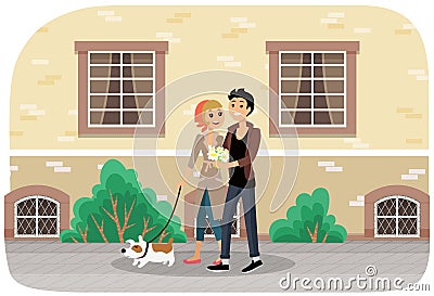 Couple with a dog walking together in the city park. Pet owners on a romantic date outdoors Stock Photo