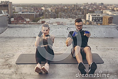 Couple doing punch crunches exercise Stock Photo