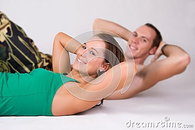 Couple doing sit ups Stock Photo