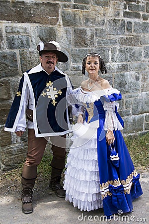 Couple dressed up as a 17th century French musketeer and noble lady during the New France Festival Editorial Stock Photo