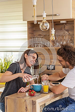 Couple eating cereal for breakfast Stock Photo