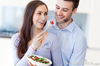 Couple eating salad Stock Photo