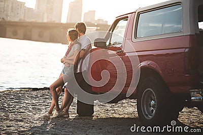 Couple embracing on beach Stock Photo