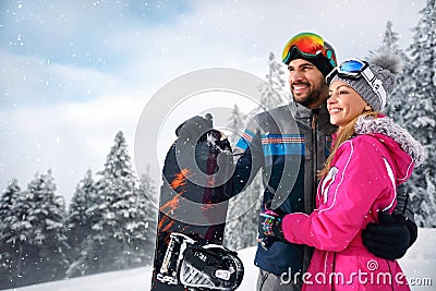 Couple enjoy skiing on mountain Stock Photo