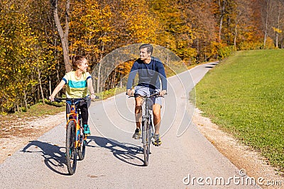 Couple enjoying cycling in the countryside during fall weekend trip Stock Photo
