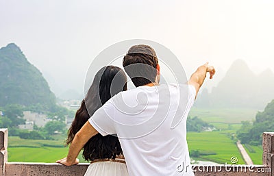 Couple enjoying Karst mountain view together Stock Photo