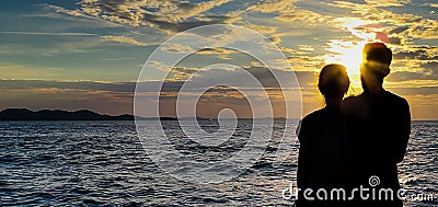 Shadow couple with a sunset background Stock Photo