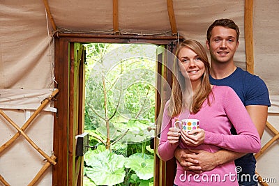 Couple Enjoying Luxury Camping Holiday In Yurt Stock Photo