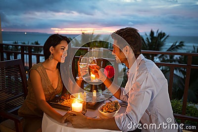 Couple enjoying a romantic dinner by candlelight Stock Photo