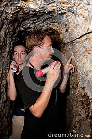 Couple exploring abandoned gold mine in Costa Rica Stock Photo