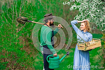 Couple Farmers. Two people walking in agricultural field. Farming gardening and people concept. Worker family Stock Photo