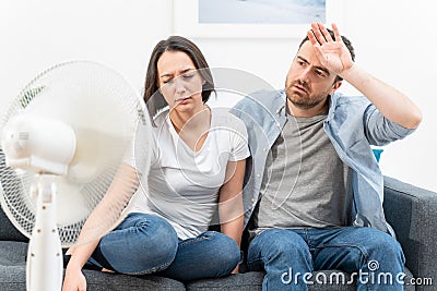 Couple feeling bad at home after summer heat Stock Photo