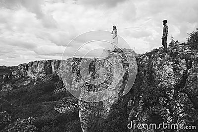 Couple in the field near the mountains Stock Photo