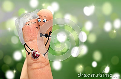 Couple with finger faces hugging and kissing Stock Photo