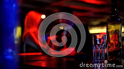 Couple first dating in nightclub, both drinking beverages, blurred background Stock Photo