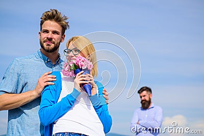 Couple with flowers bouquet romantic date. New love. Ex partner watching girl starts happy love relations. Ex husband Stock Photo