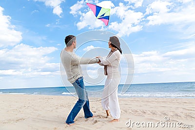 Couple fly kite Stock Photo