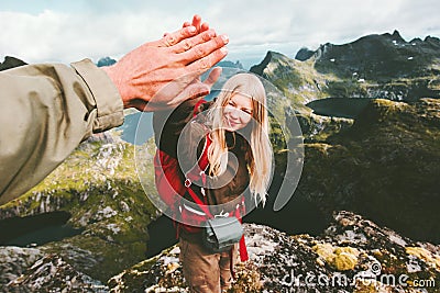 Couple friends giving five hands reached mountain top Stock Photo