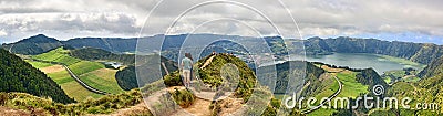 Couple in front of Crater Sete Cidades at Sao Miguel, Azores Editorial Stock Photo