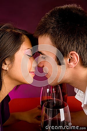 Couple Getting Closer While Having Wine Stock Photo