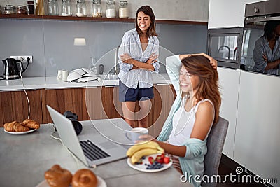 Couple girls breakfast in the kitchen and having fun. Love, Romance and valentineâ€™s day concept Stock Photo