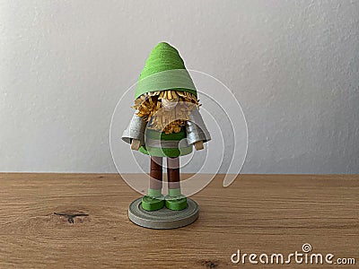 Goblin, elf, dwarf man, in green and brown and silver Stock Photo