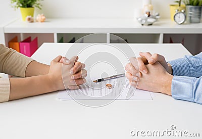 Couple going through divorce signing papers Stock Photo