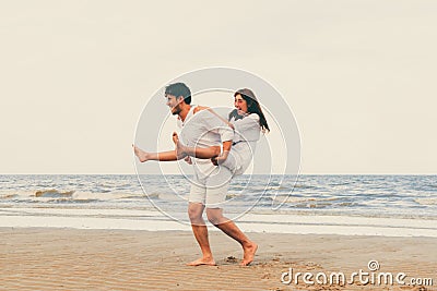 Couple going honeymoon on tropical beach in summer Stock Photo