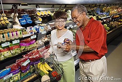 Couple in grocery store. Stock Photo