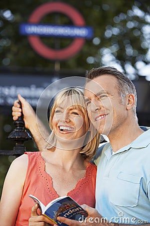 Couple With Guidebook Outdoors Editorial Stock Photo