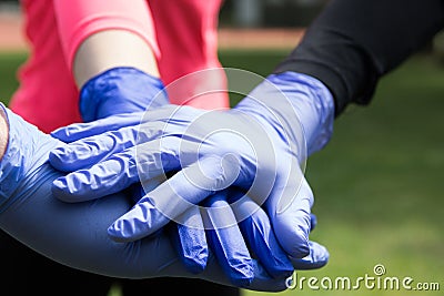 Couple of hands in the latex medical gloves. Stock Photo