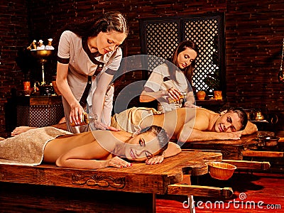 Couple having Ayurvedic spa treatment Stock Photo